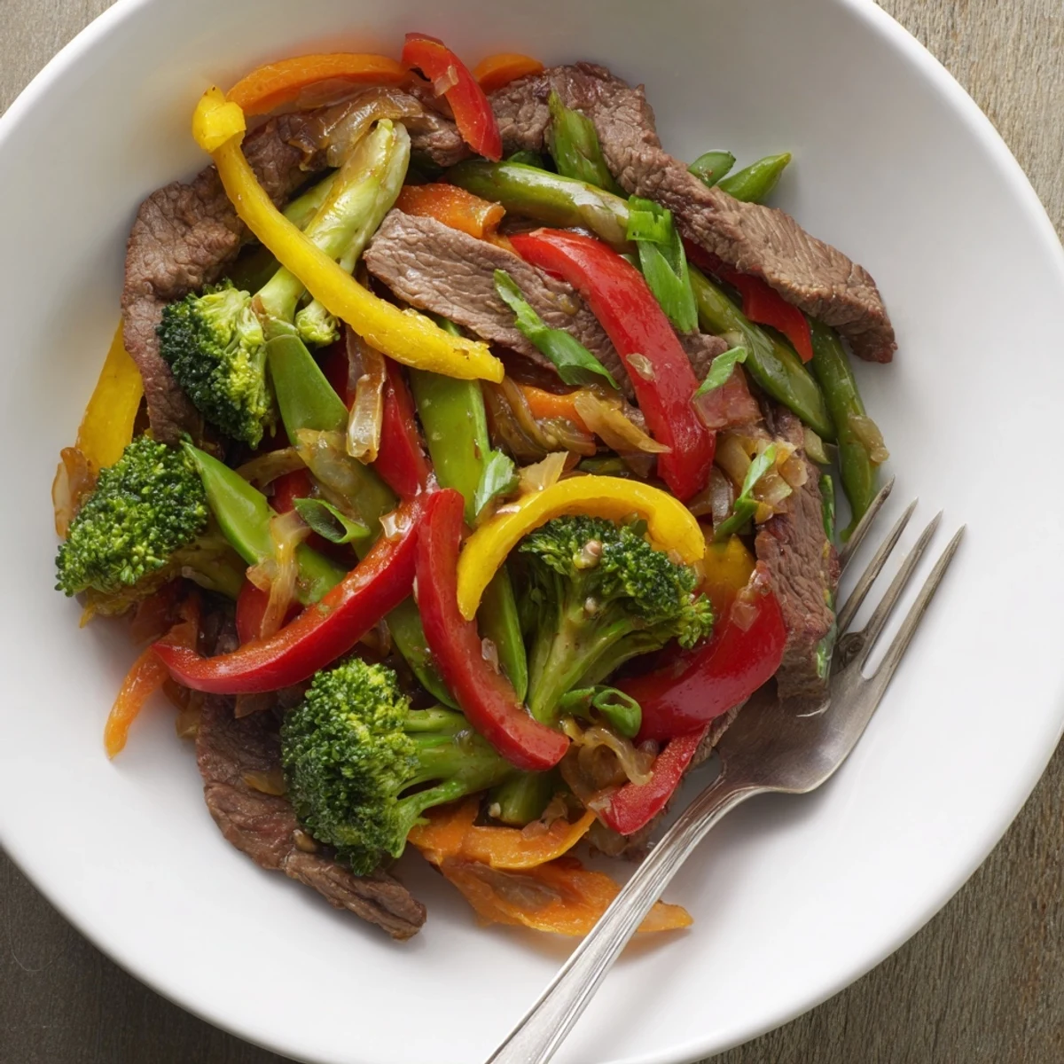 Savory beef and vegetable stir-fry in garlic sauce, vibrant colors and aroma abound.