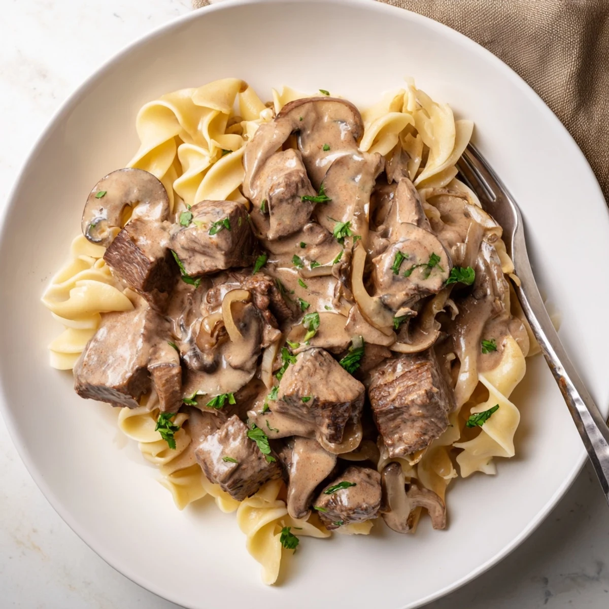 Tender beef with a velvety sauce, this slow cooker beef stroganoff is pure comfort.