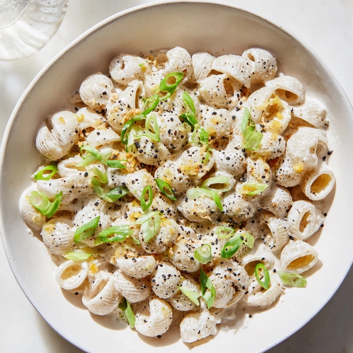 Golden creamy Japanese-inspired Miso Ditalini topped with vibrant green scallions awaiting your first bite.