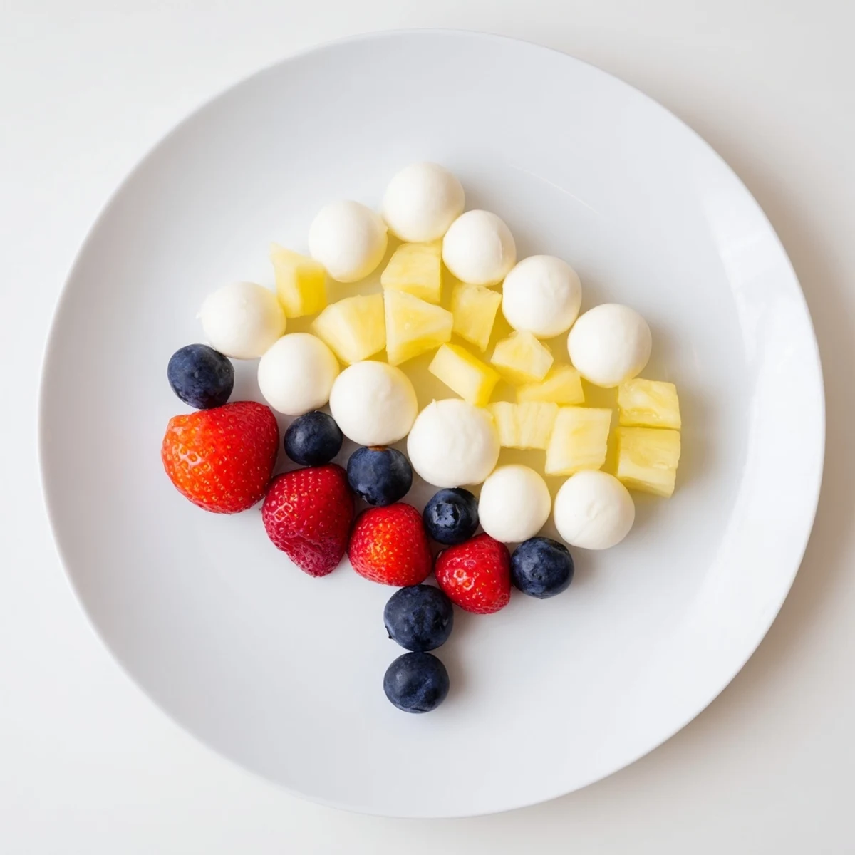 Vibrant Rainbow Cloud Snack Board arranged with colorful fresh fruits and vegetables, perfect for healthy snacking.