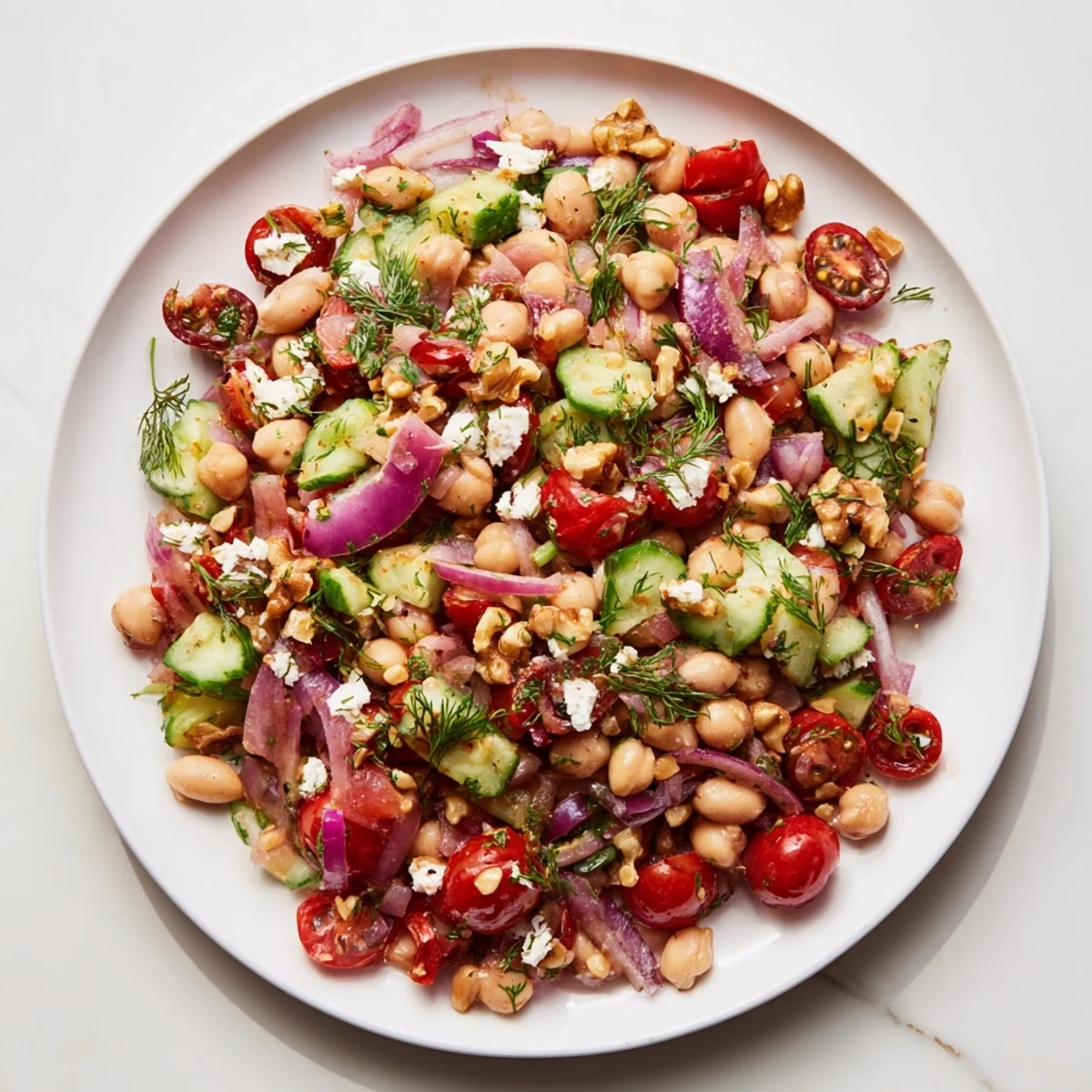 This hearty Dense Bean Salad recipe features beans, crunchy vegetables coated in tart cherry vinaigrette.