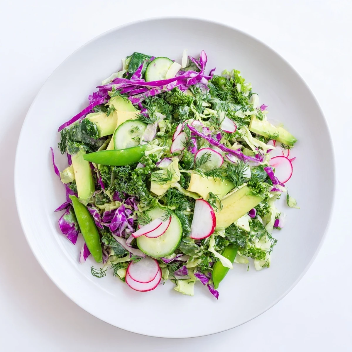 This healthy Green Goddess Detox Cabbage Salad features a rainbow of crisp vegetables, perfectly ready to serve.