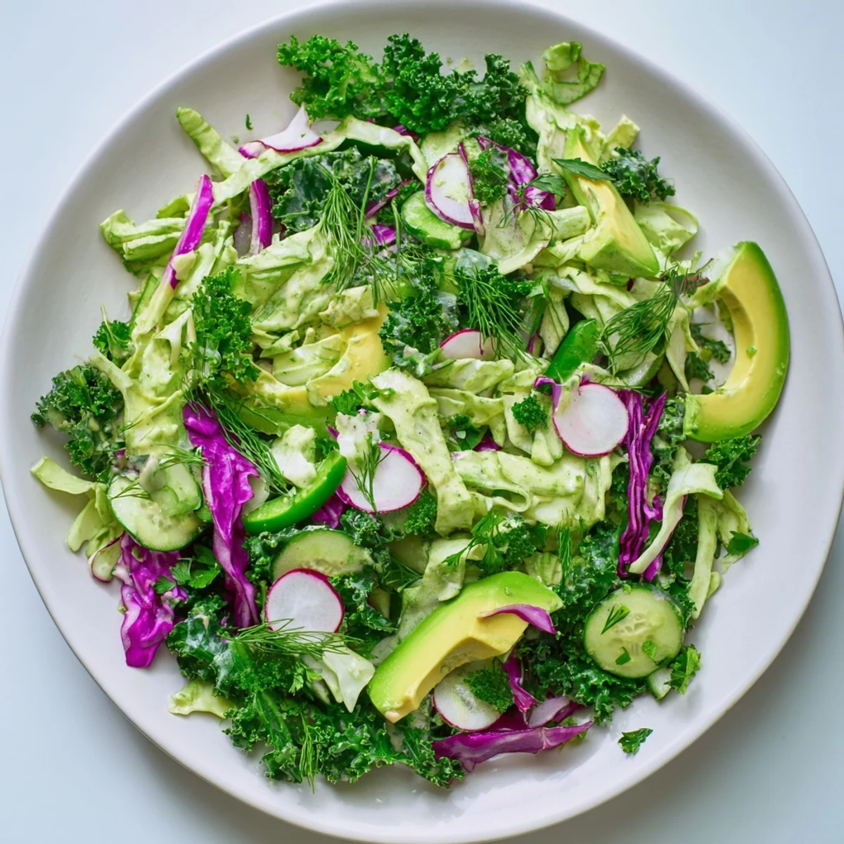 A close-up view of the vibrant Green Goddess Detox Cabbage Salad, highlighting fresh ingredients and dressing.