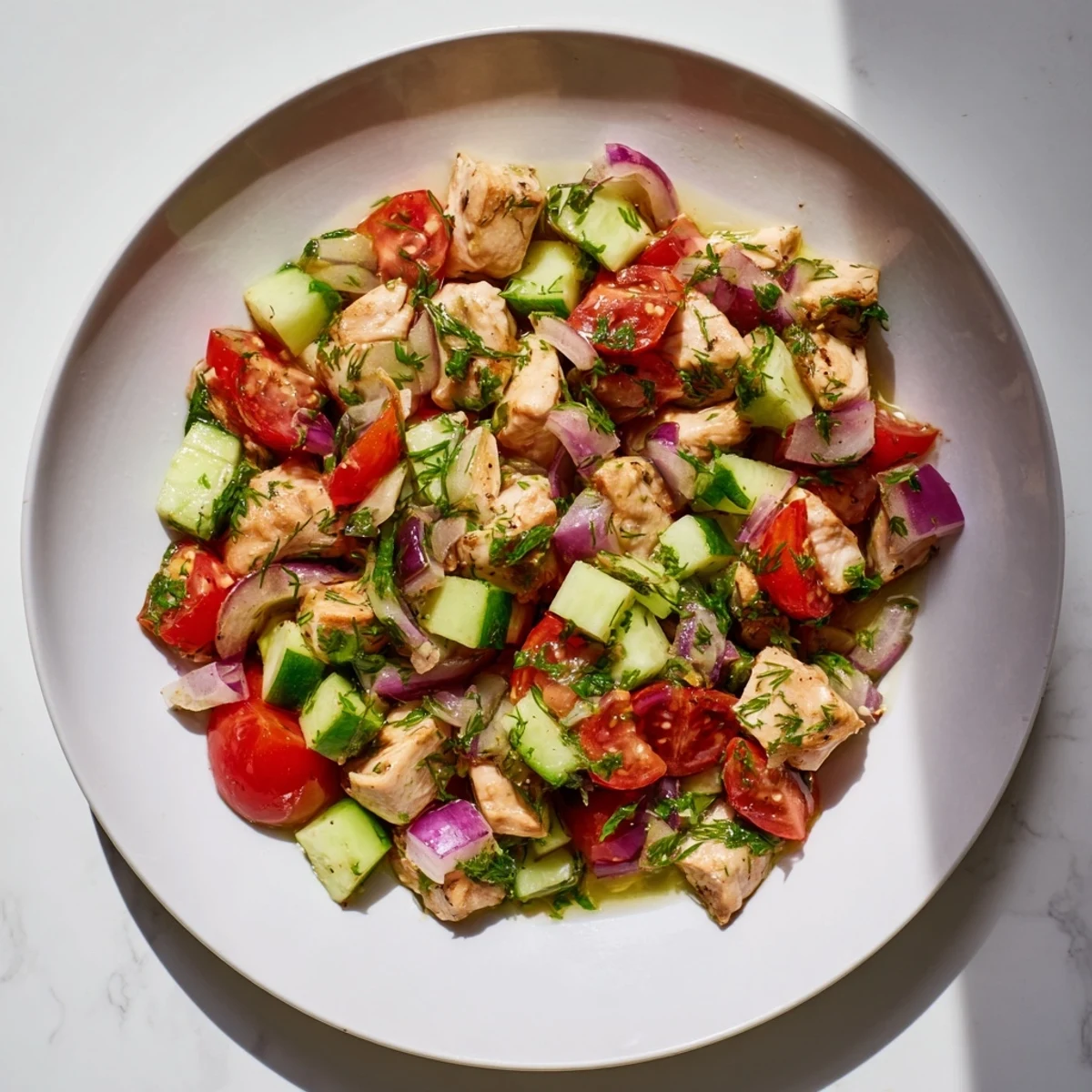 Bright and colorful bowl of Cucumber and Chicken Clean Shaker, tossed and ready to enjoy.
