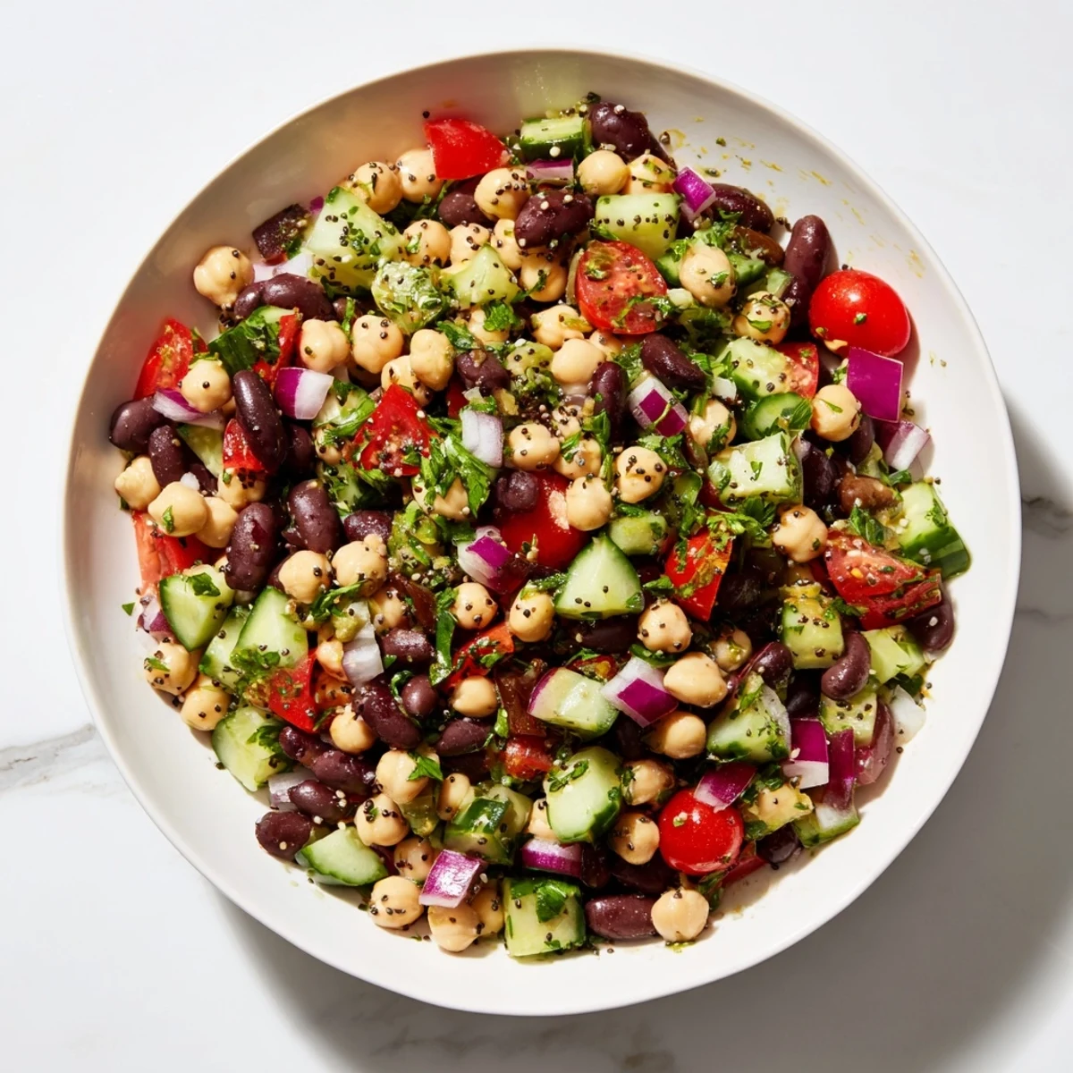 Freshly tossed Dense Bean Salad with visible chia and hemp seeds promising delicious textures in every bite.