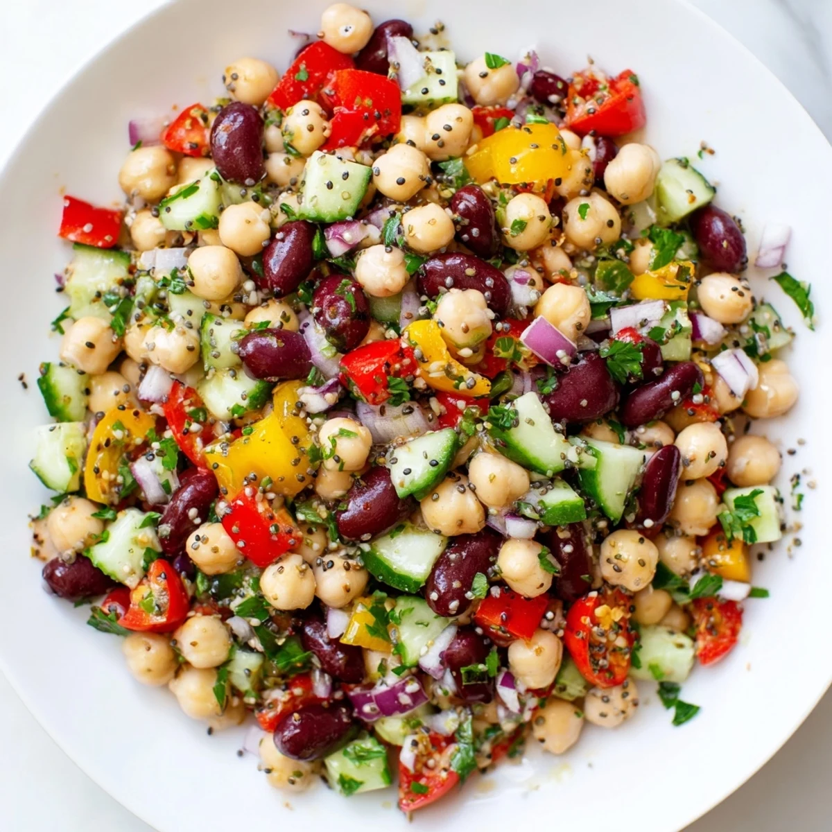 Bright and appealing bowl of Dense Bean Salad is a perfect, protein-rich lunch, ready to enjoy.