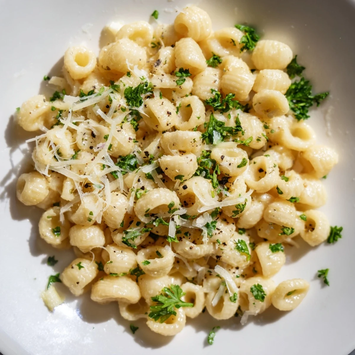Silky, sauce-coated 15-Minute Creamy Garlic Butter Ditalini pasta, garnished with fresh parsley and Parmesan cheese.