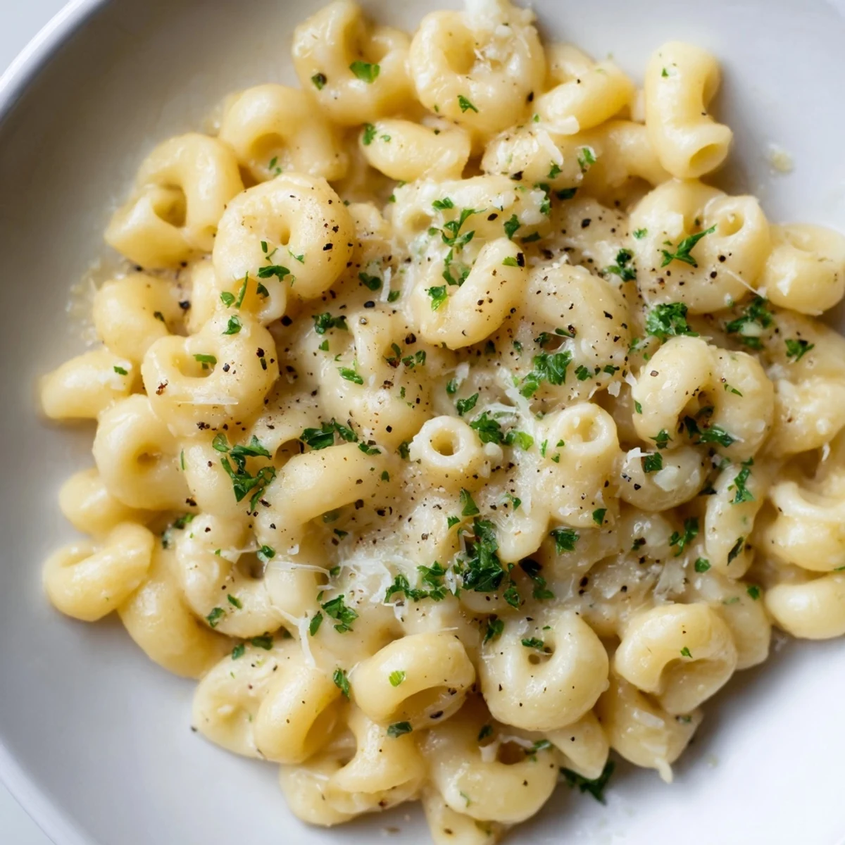 Close-up shot shows creamy texture of 15-Minute Creamy Garlic Butter Ditalini; the perfect weeknight meal.