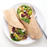 Close-up of a flavorful roasted Brussels sprouts and cranberry grain wrap, showcasing all the textures.