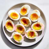 Golden Air Fryer Boiled Eggs: Picture six vibrant eggs, easy to peel after the ice bath.