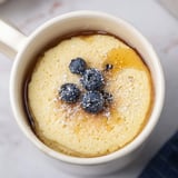 Delicious, fluffy Microwave Mug Pancakes, topped with fresh berries, ready for a quick breakfast.