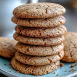 Golden-brown Hojicha Cookies on a cooling rack, showcasing their crackled tops and rich roasted green tea hue.