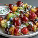 Bright, juicy fruit skewers in rainbow order served with a creamy honey-yogurt dip, a refreshing and easy no-cook treat for all ages.  