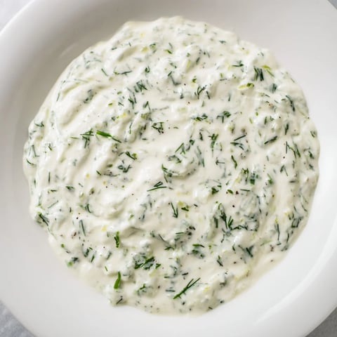 A close-up of creamy Greek Yogurt Herb Dip, perfectly seasoned and ready for dipping.
