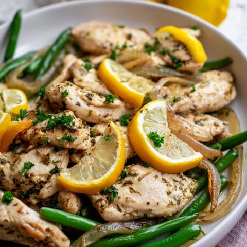 Roasted One-Pan Lemon Herb Chicken featuring zesty flavors and vibrant green beans.  