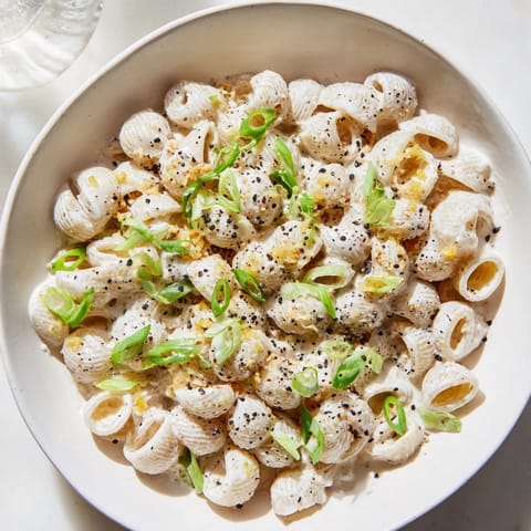 Golden creamy Japanese-inspired Miso Ditalini topped with vibrant green scallions awaiting your first bite.