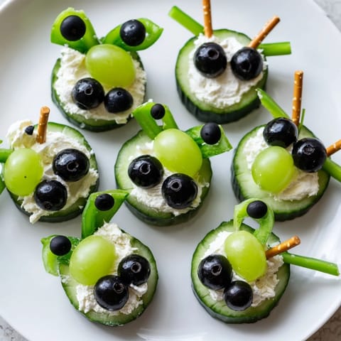 Kid-friendly Little Green Men Alien Snack Attack: Colorful, healthy, bite-sized snack with olives and cream cheese.