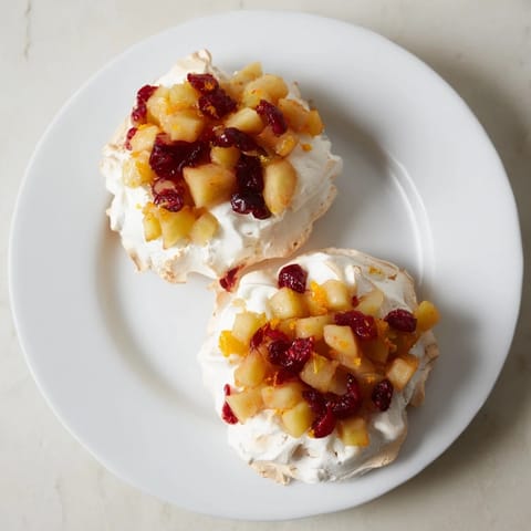 Enjoy a warm Cranberry and Pear Snowscape, a visually stunning winter dessert with glistening fruit.