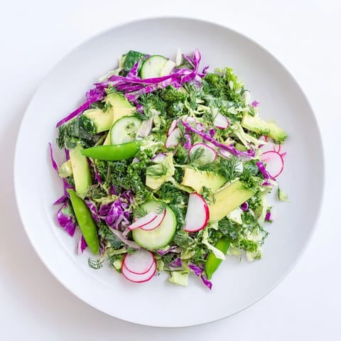 This healthy Green Goddess Detox Cabbage Salad features a rainbow of crisp vegetables, perfectly ready to serve.