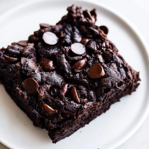 A close-up of deeply delicious black bean brownies, perfect for a gluten-free dessert.