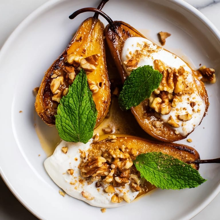 Sweet, tender roasted pears sprinkled with cinnamon, served atop creamy Greek yogurt, and walnuts.