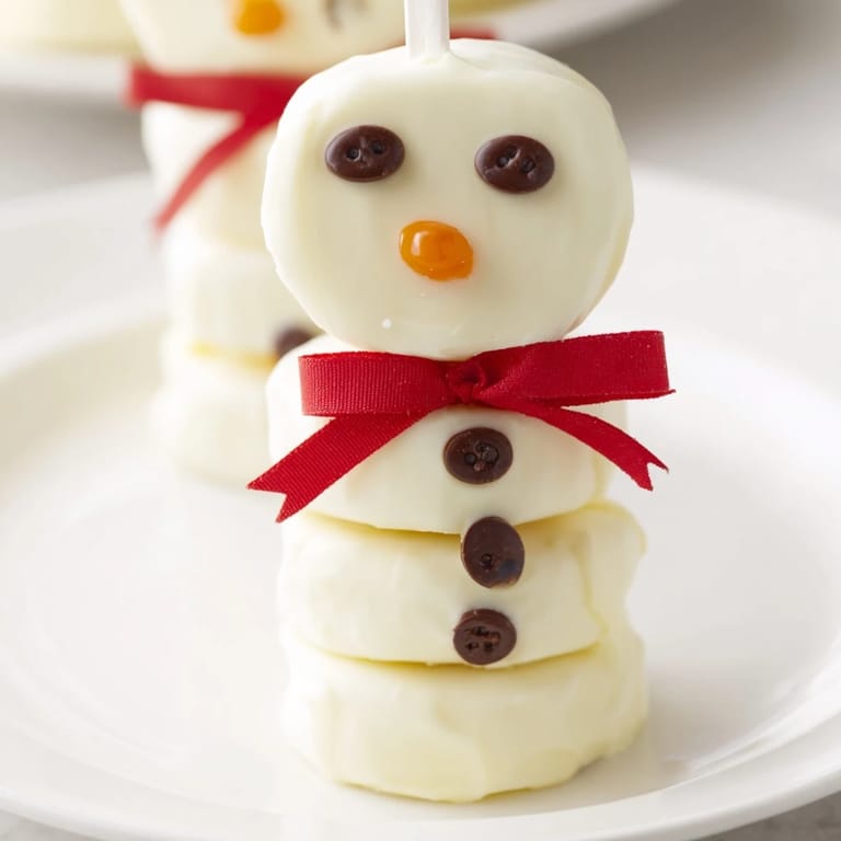 Quick and easy Express Snowman Marshmallow Pops, a delightful winter dessert perfect for kids and adults.