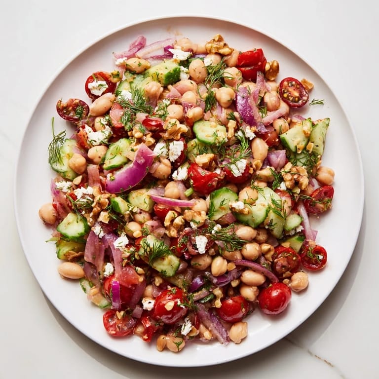 This hearty Dense Bean Salad recipe features beans, crunchy vegetables coated in tart cherry vinaigrette.