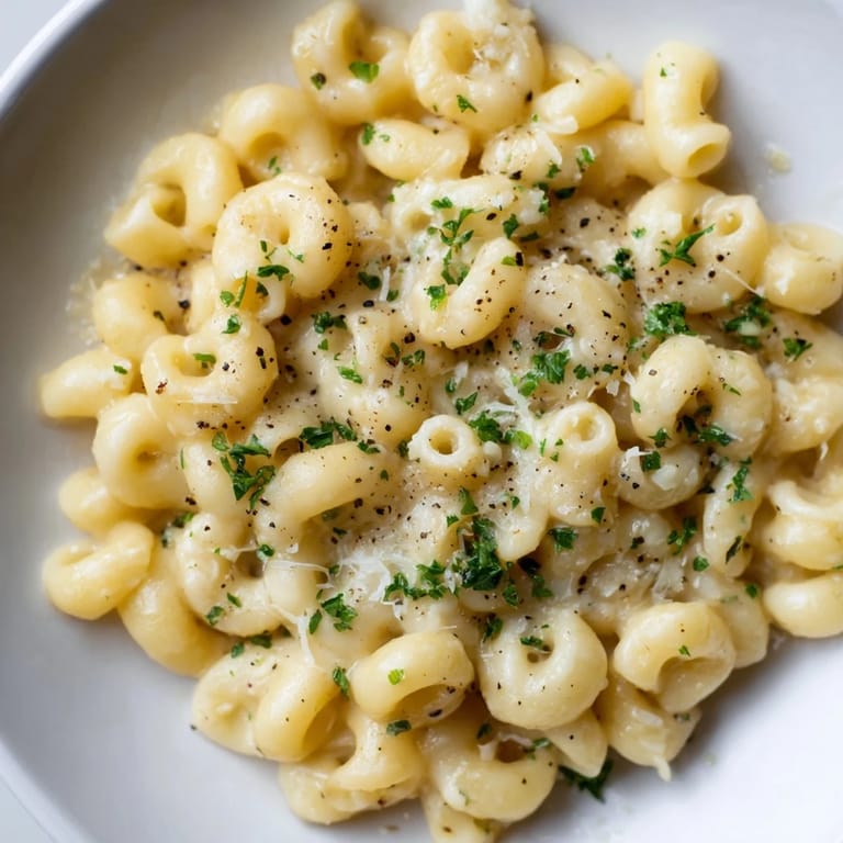 Close-up shot shows creamy texture of 15-Minute Creamy Garlic Butter Ditalini; the perfect weeknight meal.