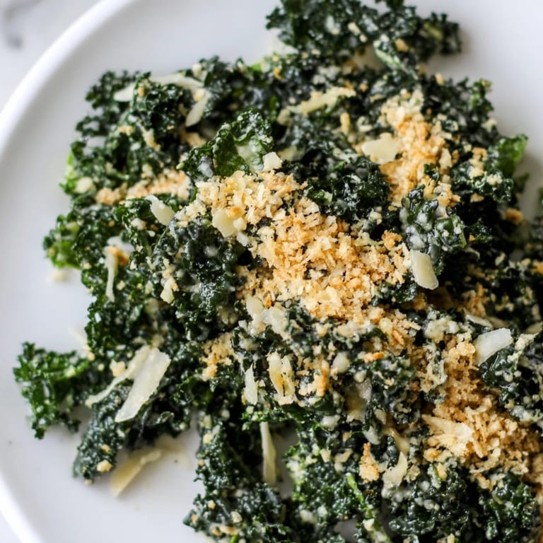 Crunchy panko breadcrumbs over tender kale leaves in a rich garlic Parmesan dressing, perfect for a quick vegetarian side.