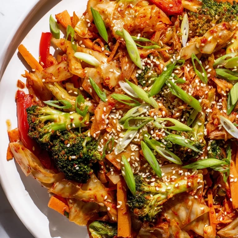A large wok holds a vibrant stir-fry of crisp winter veggies and probiotic kimchi, showcasing the wholesome Comforting Fermented Veggie Winter Stir-Fry.